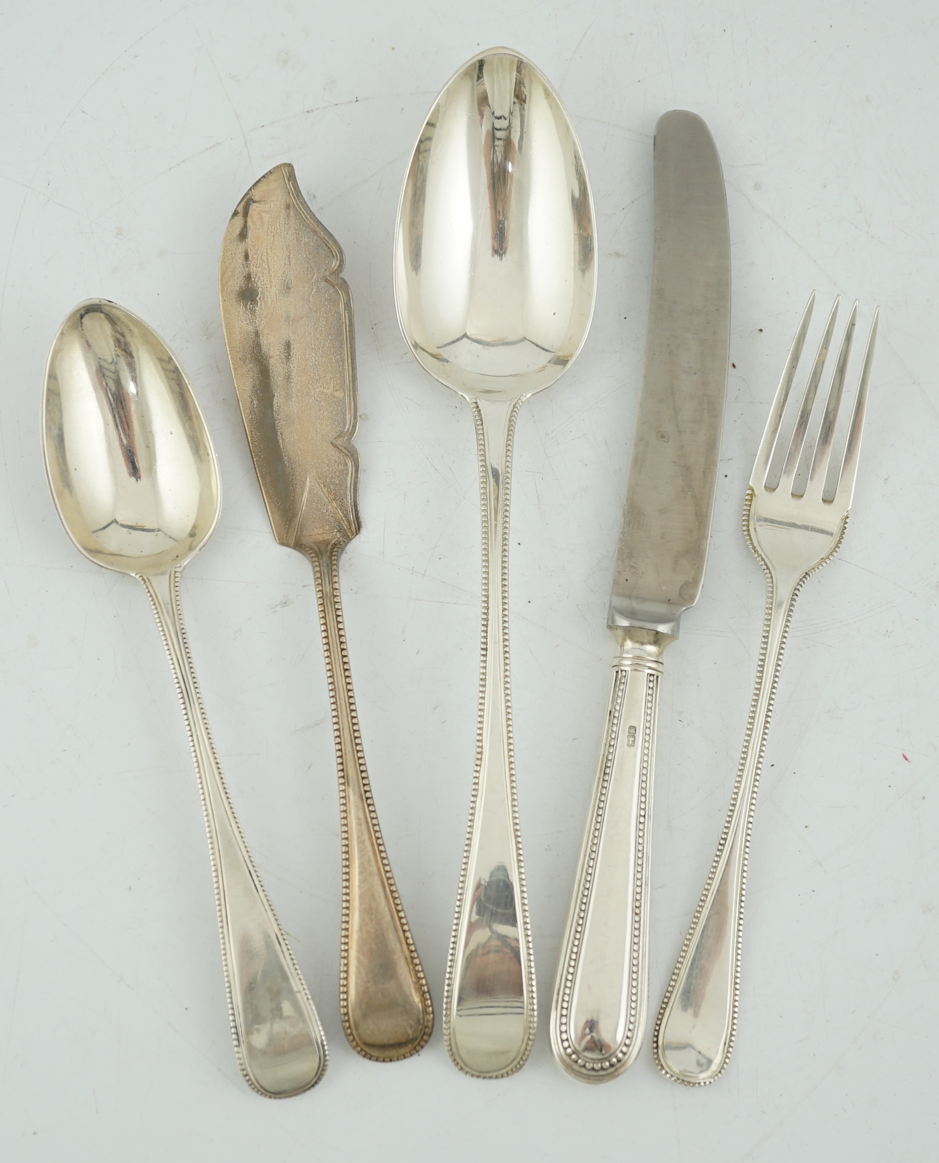 A matched part canteen of Victorian silver Old English beaded pattern flatware, by George Adams